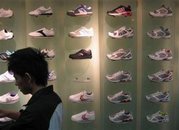 A sneaker store in China's southern city of Guangzhou February 17, 2008. A recent poll has found that people who buy three pairs of sneakers or more a year are far more likely to be a leadership type that other people. (Joseph Chaney/Reuters)